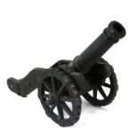 A very heavy and quite large fireside cast iron Cannon poker holder with brass handled poker. Barrel