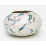 An Art pottery bowl of compressed circular form decorated with scrolling foliage, approx 26cms (