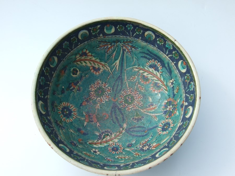 An Iznik pottery bowl decorated with flowers on a green ground, 27cms (10.5ins) diameter; together - Image 14 of 17