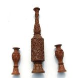 An Indian carved hardwood table lamp, 77cms (30.5ins) high; together with two similar vases,