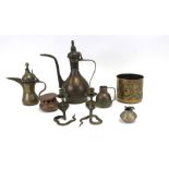 A group of Indian / Islamic brassware to include a dallah coffee pot; a wine ewer; a pair of cobra