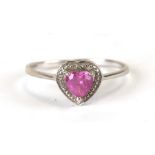 A 9ct white gold ring set with a heart shaped pink stone, weight 1.5g, approx UK size 'O'.