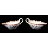 A pair of 18th century Chinese famille rose sauce boats, 20cms (8ins).Condition ReportThere is a
