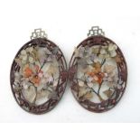A pair of Chinese pierced hardwood and gem stone wall plaques, 18cms (7ins) high.