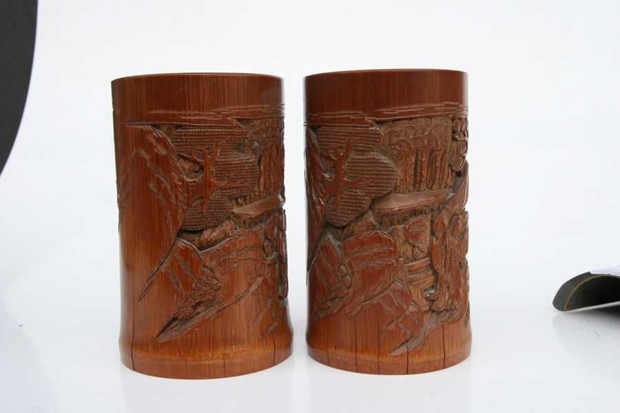 A pair of Chinese bamboo brush pots decorated with figures in a landscape, 15cms (6ins) high); - Image 9 of 10