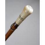 A William and Mary ivory handled walking cane, the crown with pique initials and date 'E. S 98',