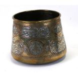 A Persian / Cairo ware palm pot with copper and silver decoration to include Islamic script,