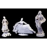 A Hochst porcelain figure in the form of a lady wearing a ballgown, 18cms (7ins) high; together with
