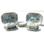 A pair of 19th century Chinese famille rose tureens and covers on stands, 19cms (7.5ins) wide;