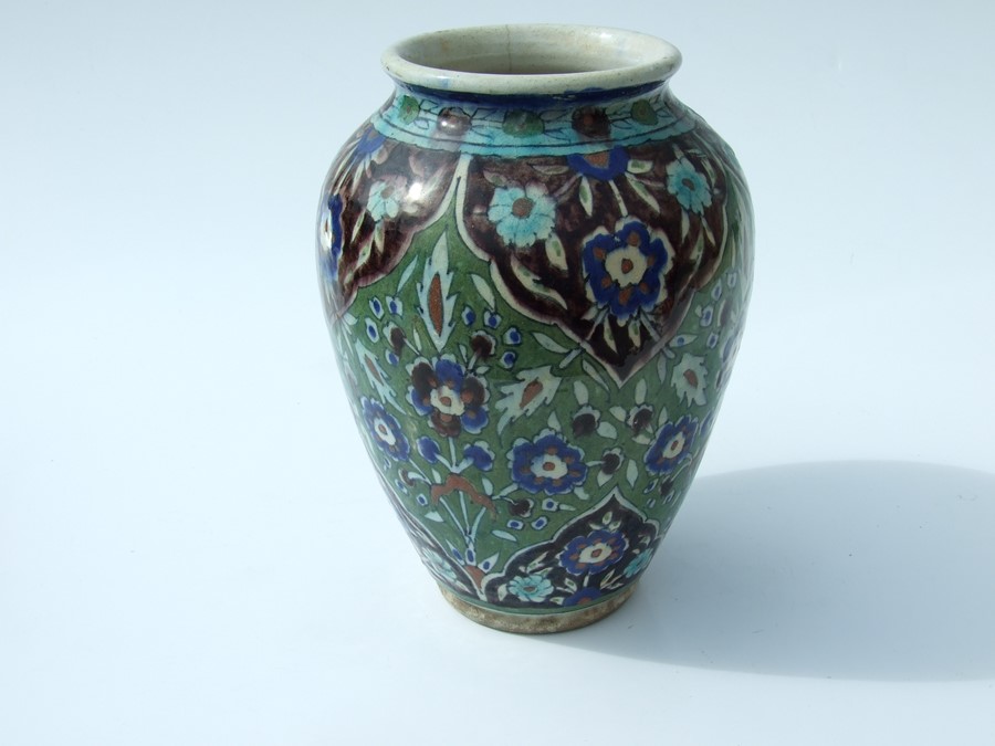 An Iznik pottery bowl decorated with flowers on a green ground, 27cms (10.5ins) diameter; together - Image 10 of 17
