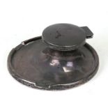 A silver Capstan inkwell, Birmingham 1925, 10cms (4ins) wide.