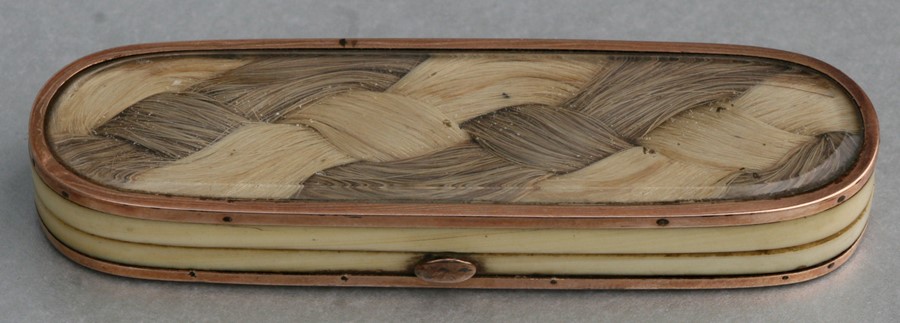 A Georgian ivory toothpick box with yellow metal mounted hair plait to the top and base, 9cms (3.