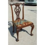 A Georgian mahogany chair with drop-in upholstered seat, on acanthus capped cabriole legs with ball