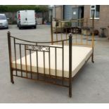 A brass double bed.Condition ReportGood clean condition and measures 4'6 by 6'3ins.