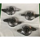 A set of four 1930s Daimler chrome knock-off wire wheel spinners (two eared), new old stock