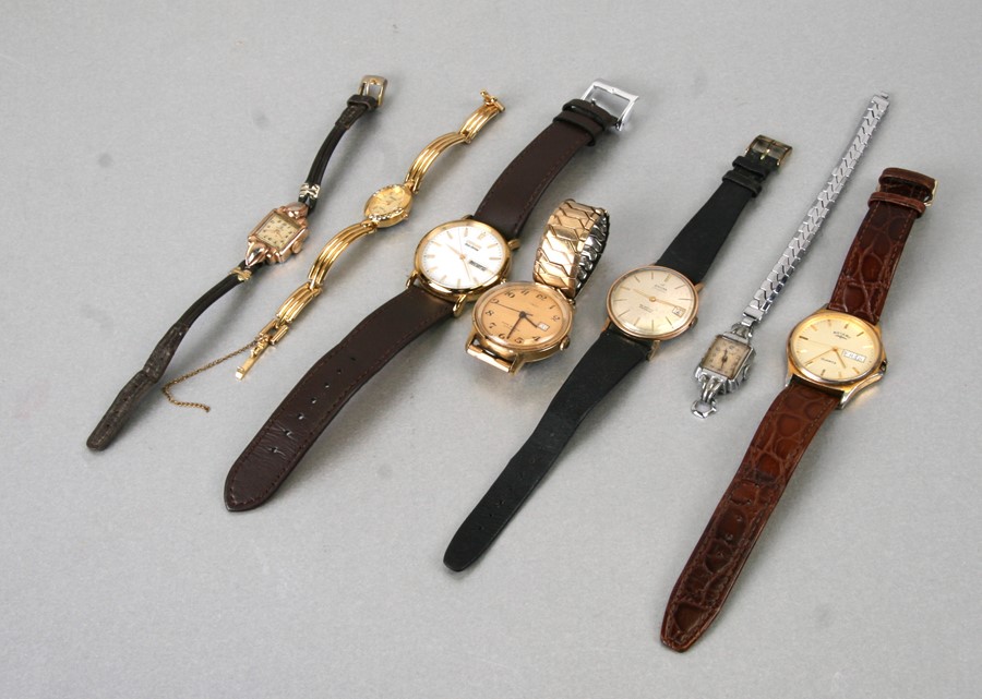 A group of ladies and gentleman's wristwatches.