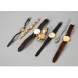 A group of ladies and gentleman's wristwatches.