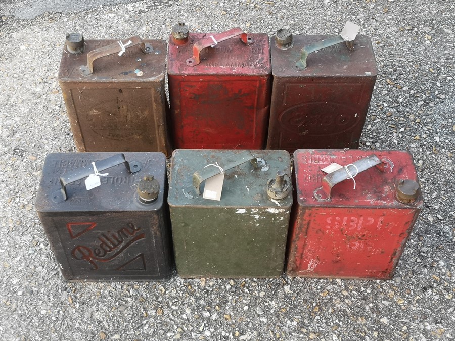 Six 1930's two-gallon petrol cans to include Esso, Pratts and BP, all with brass caps (6).