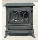 A cast iron electric wood burning effect fire. 54cm ( 21 ins) wide