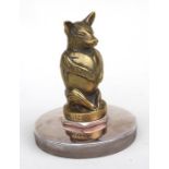 A Charles Paillet Accessory car mascot, in the form of a pig emerging from an egg, cast brass,