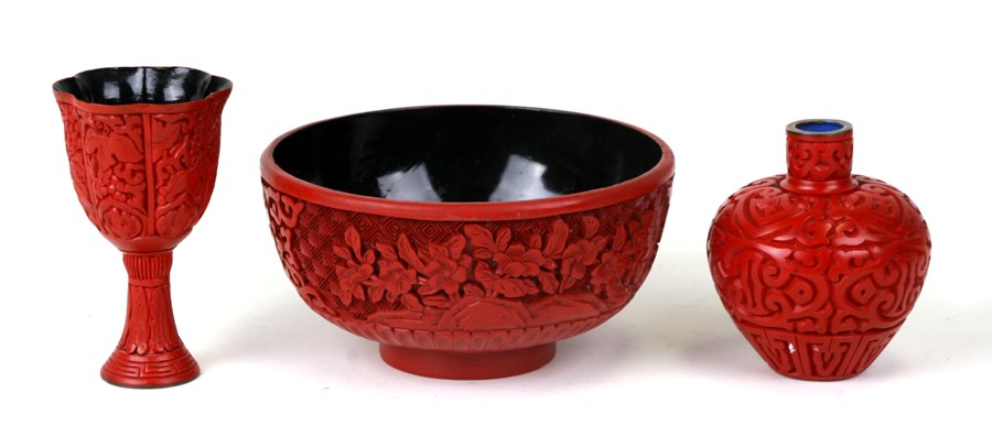 A Chinese cinnabar lacquer footed bowl, 12.5cms (5ins) diameter; together with two similar vases (