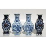 A pair of Chinese blue & white vases decorated with river landscape scenes within panels, 27cms (