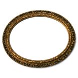 An oval gilt framed wall mirror, 58cms (23ins) wide.