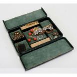 A quantity of costume jewellery to include a gold plated guard chain in a green jewellery box.