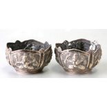 A pair of Burmese / Indian white metal salts, 6cms (2.5ins) diameter.