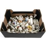 A quantity of crested ware to include Noah's Ark, Florence Nightingale and a milk churn.