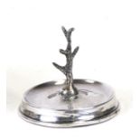 A silver ring stand on a circular stepped base, maker's mark 'JE' London, 1921, weight 189g, 6.