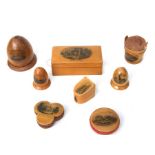 A collection of Victorian sewing related Mauchline ware to include pin cushions and thimble cases.