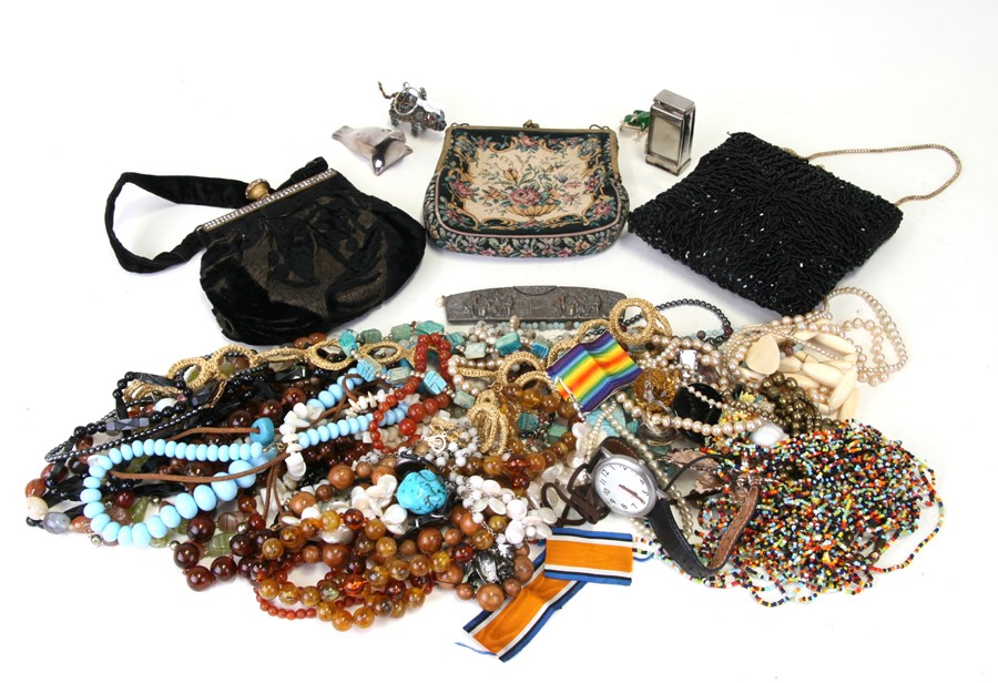 A quantity of costume jewellery together with three ladies evening bags