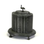 A sliver plated tea caddy of oval form, on ball & claw feet with emu finial, 22cms (8.5ins) high.