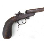 A late 19th century double barrel precision pistol with walnut stock (damaged), 37cms (14.5ins)