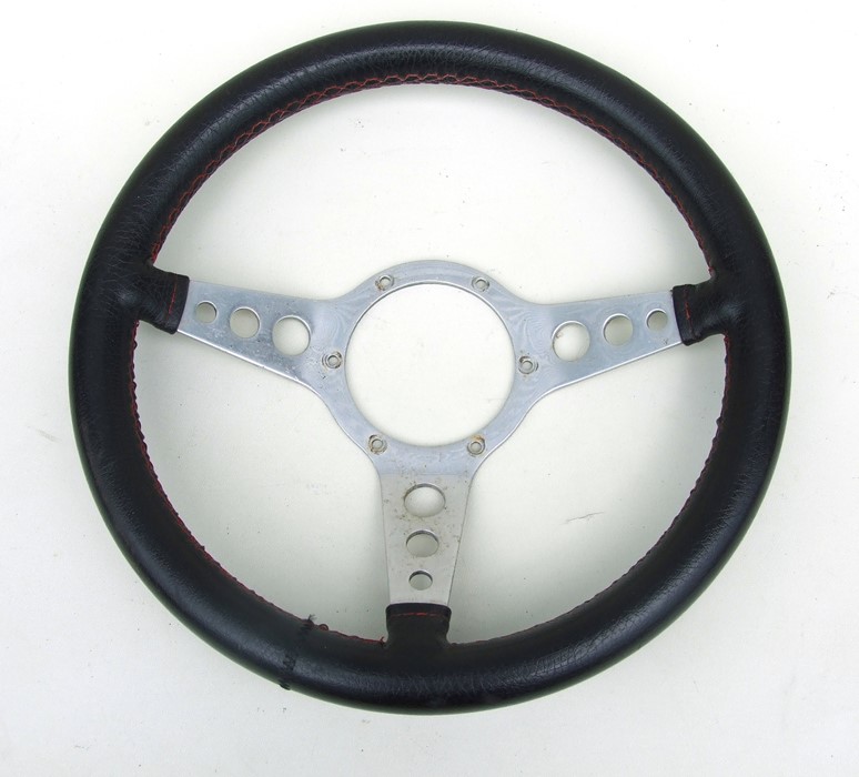 A leather rimmed aluminium three-spoke dished steering wheel, 36cms (14ins) diameter.