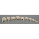 A group of early 20th century graduated ivory elephants. largest 4cm (1.5 ins) high