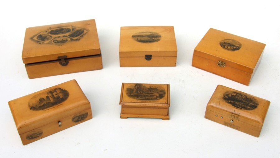 A collection of Victorian Mauchline ware boxes, the largest 17cms (6.5ins) wide.