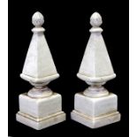 A pair of painted stone effect garden obelisks with pineapple finials, 40cms (15.75ins) high.