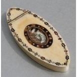 An 18th century ivory snuff box of navette form inlaid with yellow metal, tortoiseshell and mother