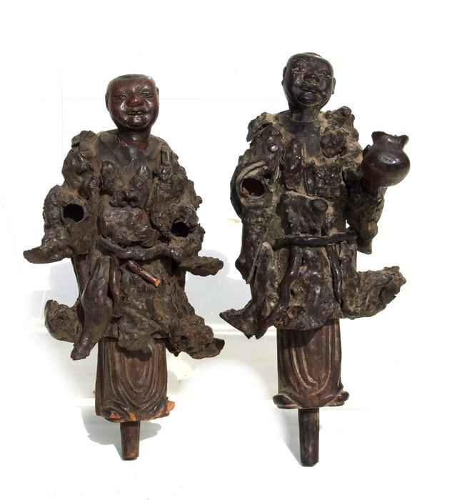 A pair of Chinese carved rootwood figures, 25cms (9.25ins) high.