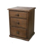 A painted pine chest of three graduated drawers, 57cms (22.5ins) wide.