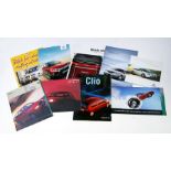 A collection of car sales brochures including, Mini, Ford, Vauxhall, Suzuki, Renault and others.