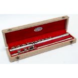 A Leslie Sheppard three-piece silver plated flute, cased.