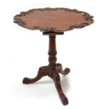 A Georgian style mahogany tilt-top occasional table with bird-cage mechanism, on turned column and
