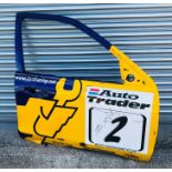A door from the ex Anthony Reid BTCC Ford Mondeo, having sponsorships stickers for Auto Trader,