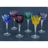 A harlequin set of six flashed glass hock glasses with faceted stems, each 19cms high (6).