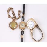 A ladies 18ct gold fob watch style wristwatch with white porcelain dial and Arabic numerals, on a