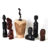 A group of African tribal figures; together with a hide drum.