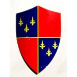 A painted metal heraldic shield, approx 45cms wide.